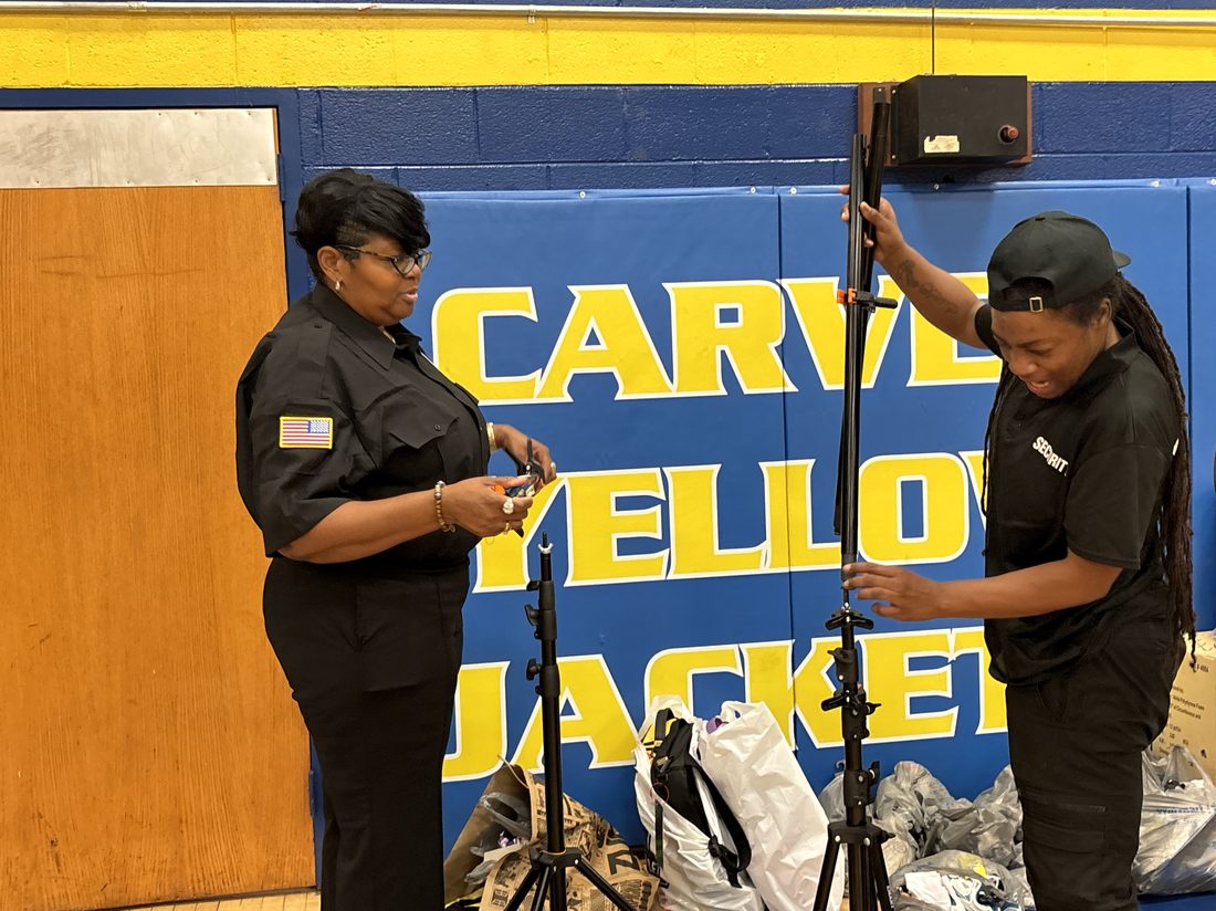 Officers setting up security equipment before an event