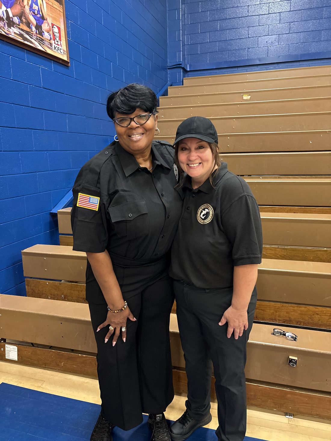 Two Hammerhead Security officers on assignment at a school gymnasium event